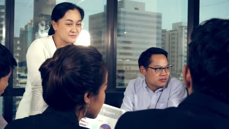 asian business people discuss marketing strategy.