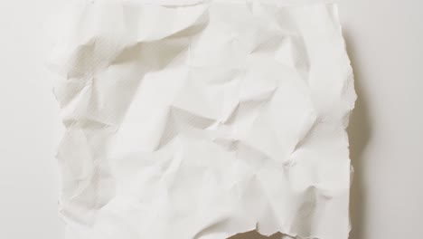 video of close up of crumpled white paper texture on white background