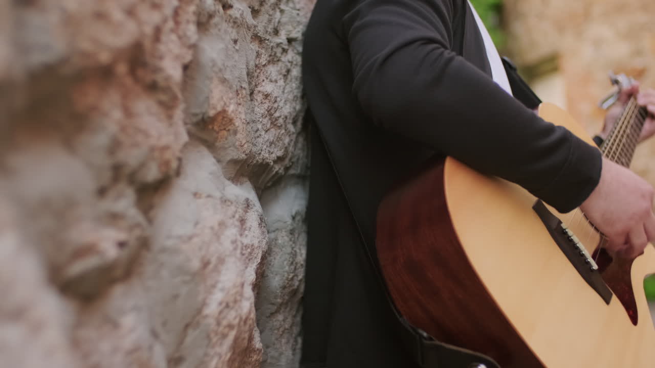 Unrecognizable Street Musician Playing Outside