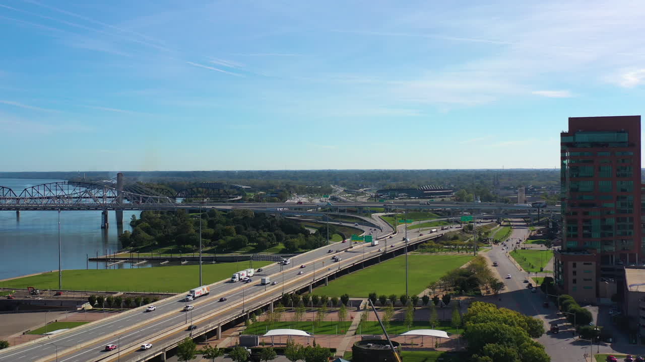 Aerial View of a City with a River, Bridge, and Highway