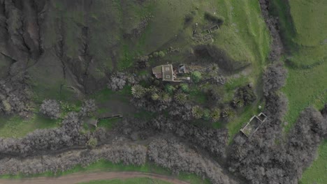 Top-down-lowering-view-over-old-house-in-Serra-de-Dentro-at-Porto-Santo-island