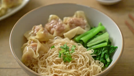 dried egg noodles with pork wonton or pork dumplings without soup asian food style