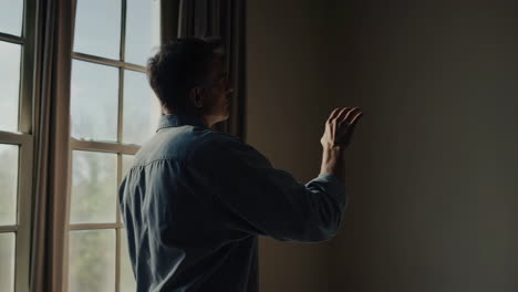 man by the window