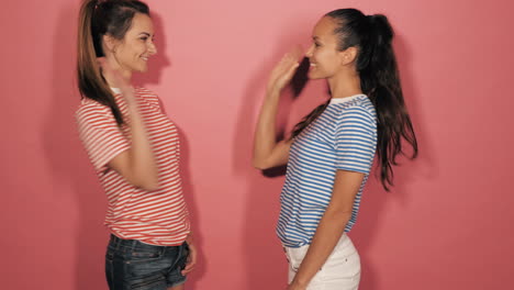 two women in striped shirts