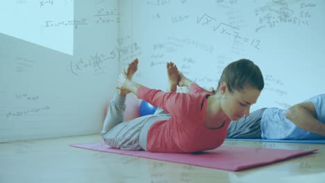 Animation-of-mathematical-equations-floating-over-Caucasian-couple-exercising