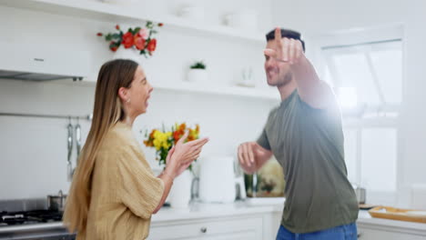 Fun,-kitchen-and-happy-couple-dance-to-music