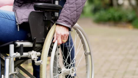 woman in wheelchair outdoors