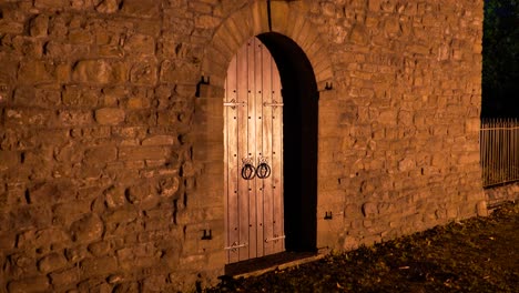 Old-church-lit-up-at-night-with-railings