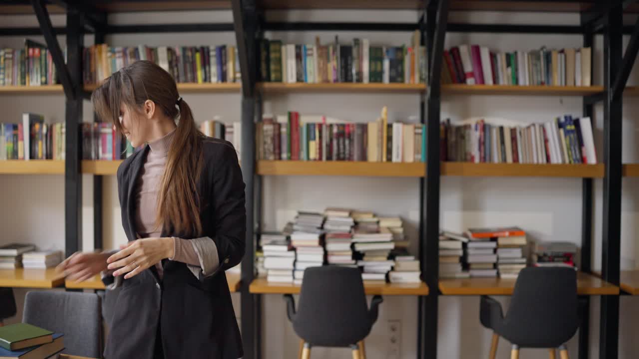 Woman Dancing in a Modern Library