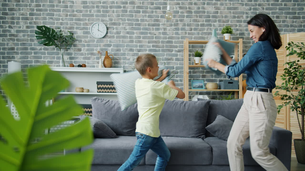 Mother and Son Having a Pillow Fight