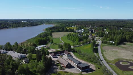 low flyover of lake tuusula farmhouse in vibrant finland near kerava