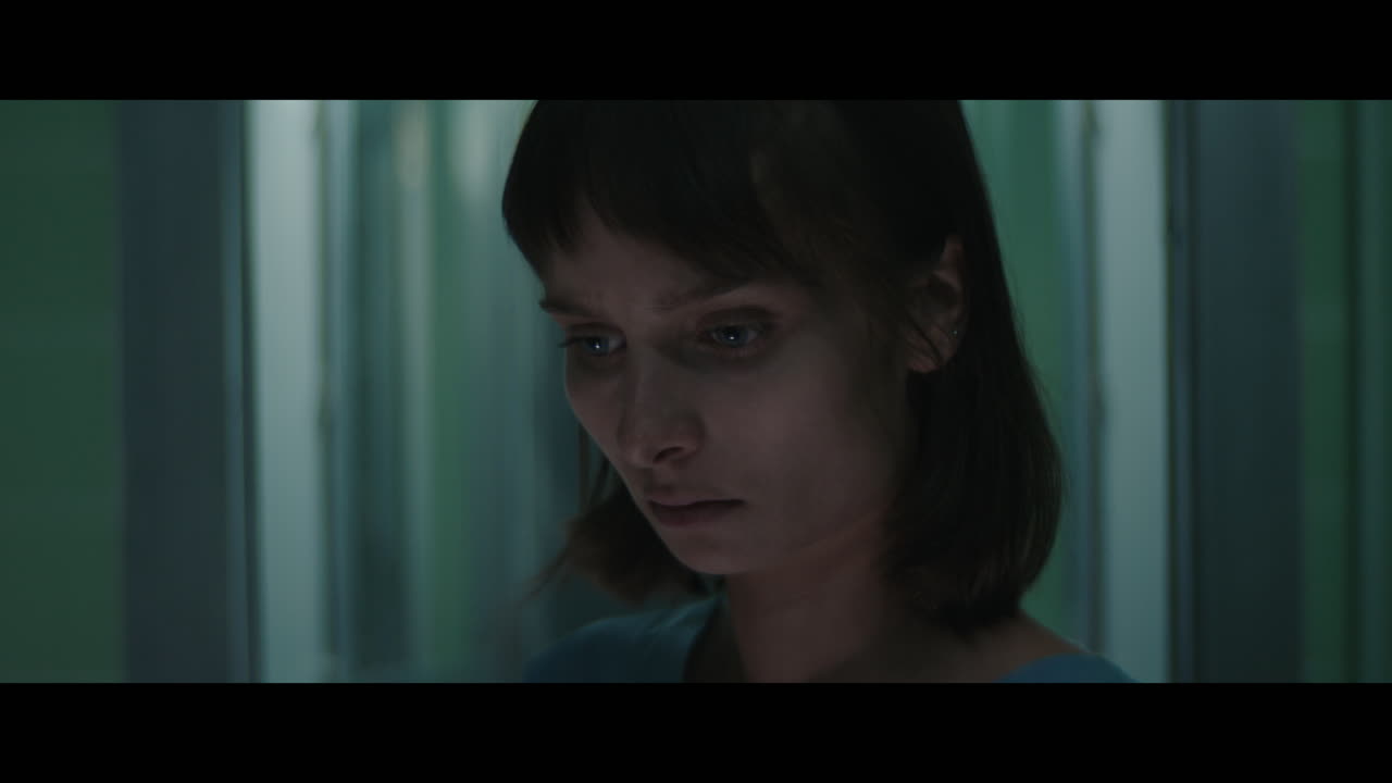 A girl in a strange operation room at night