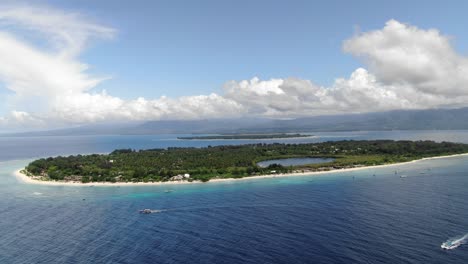Ascent straight up showing Gili Meno's saltwater lake, Gili Air and Lombok in background. Aerial