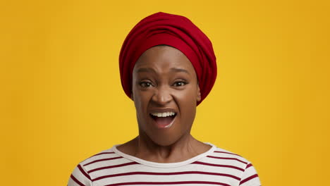 excited woman wearing red hijab
