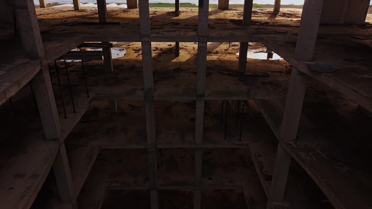 View of abandoned building structure near beach at midday