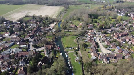 drone flies over the church of the small village fordwich, england