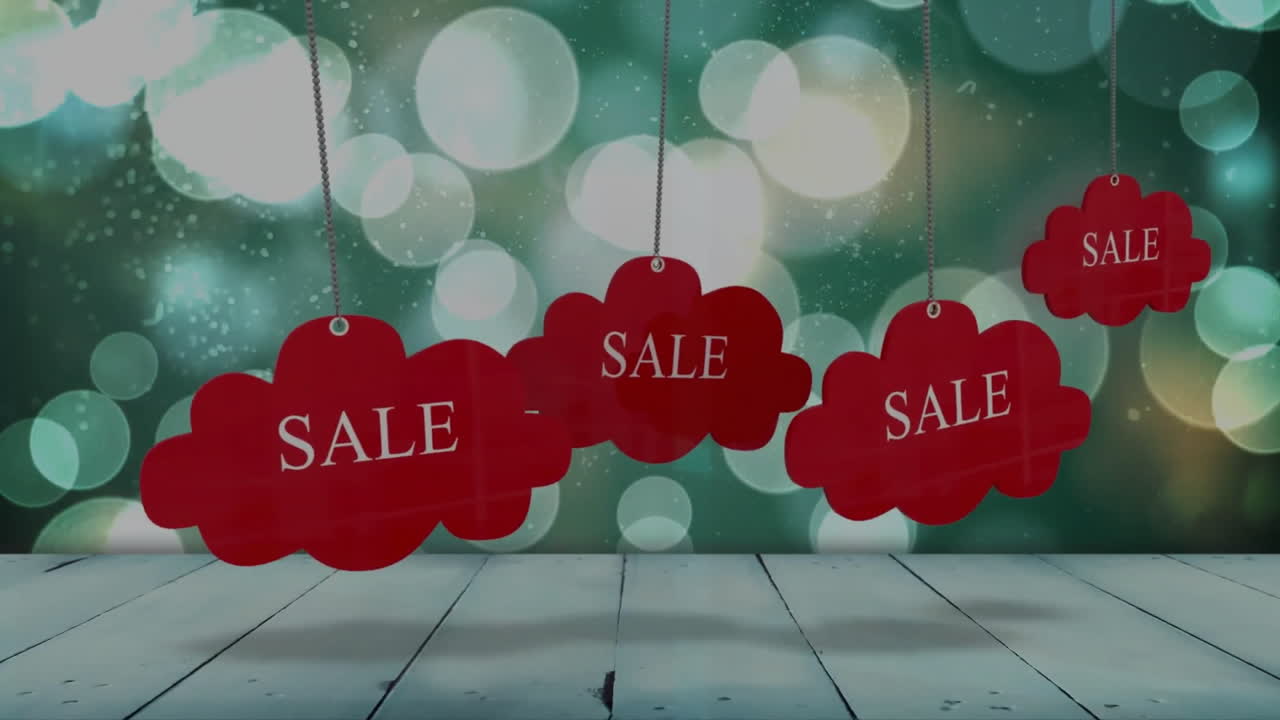 Red sale tags hanging over bokeh lights animation on wooden background