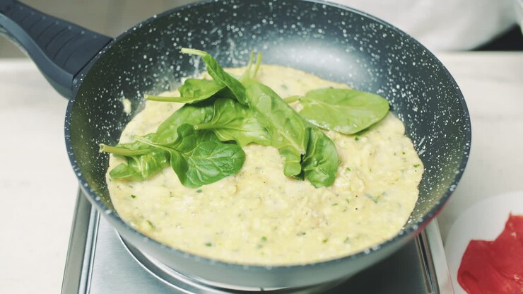 Decorating Omelet with Fresh Spinach