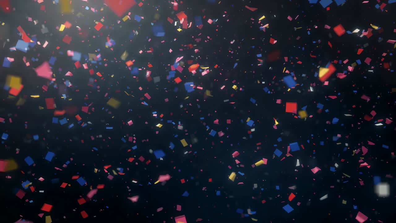 Quadrati di coriandoli luminosi che si spostano verso il basso dopo un’esplosione fuori campo con riflesso dell’obiettivo in uno studio buio