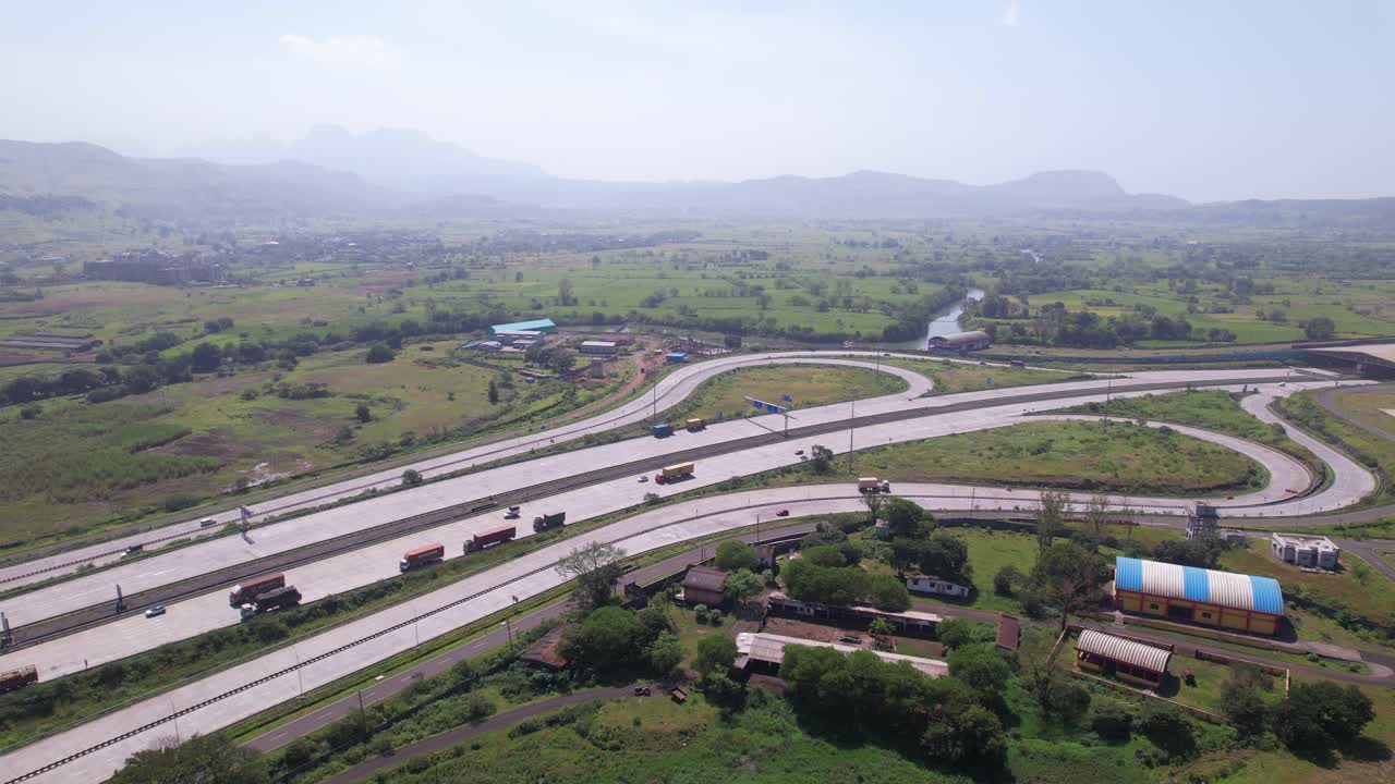 Igatpuri Interchange on Samruddhi Mahamarg, green corridors covered in morning haze, Maharashtra, drone shot