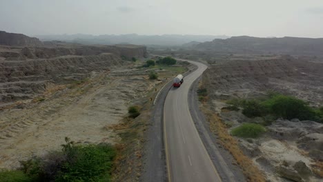 Aerial-Following-Oil-Tanker-Driving-Along-Makran-Highway-Through-Hingol-National-Park