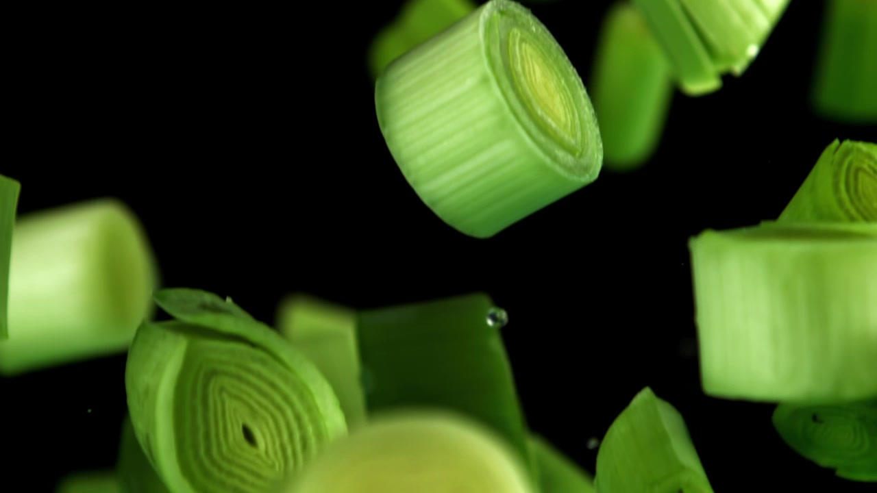Fresh Chopped Green Onions Falling in Slow Motion