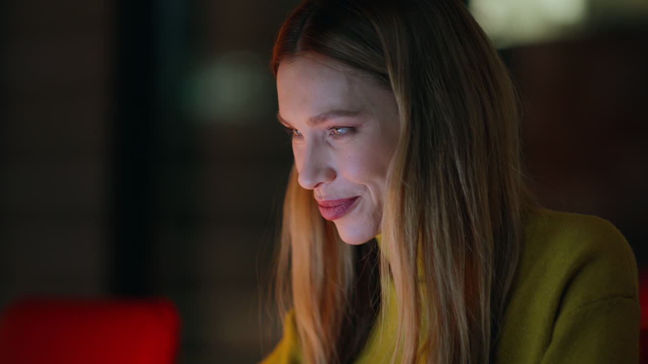 Smiling lady typing computer at night workplace closeup. Inspired woman overtime