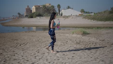 woman exercising on the beach