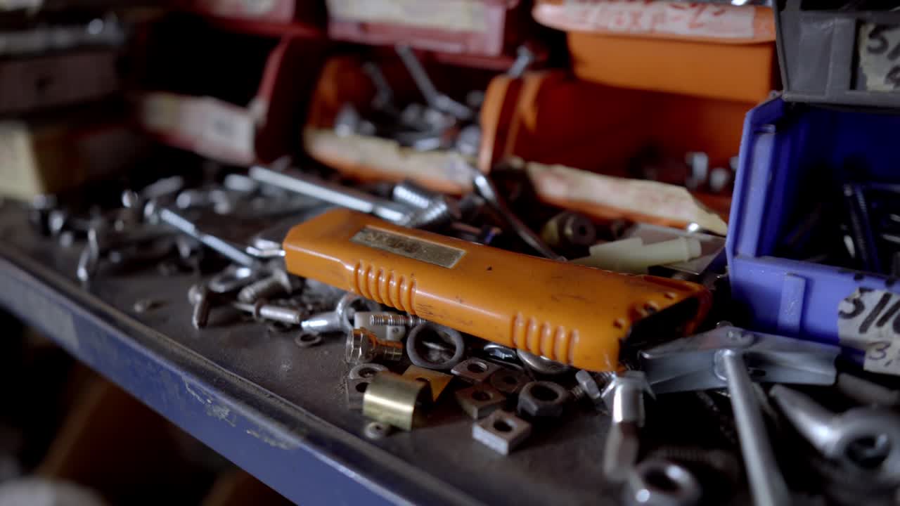 Close Up of Assorted Hardware on a Workshop Shelf