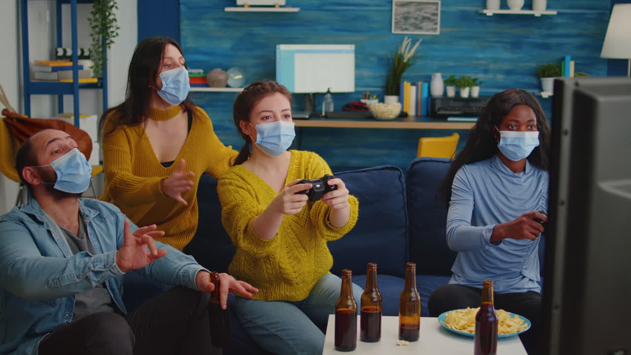 Excited multiethnic friends trying to win video games