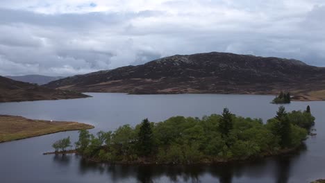 Tilt-down-droneshot-of-scottish-higland-lake