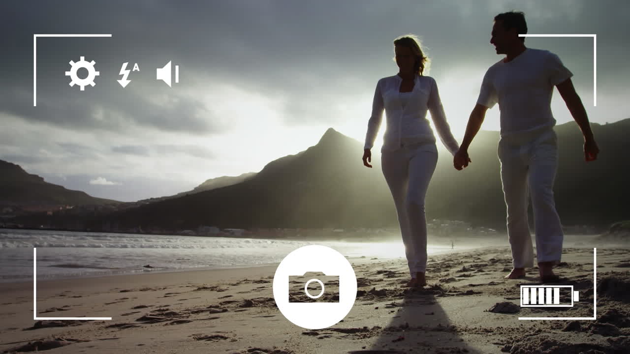 tomando fotos de una pareja con una cámara digital