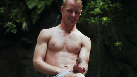 small bird in excited man's hand eating suddenly flies away, slow motion