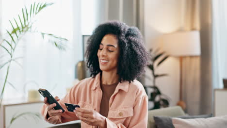 woman using phone and credit card for online shopping