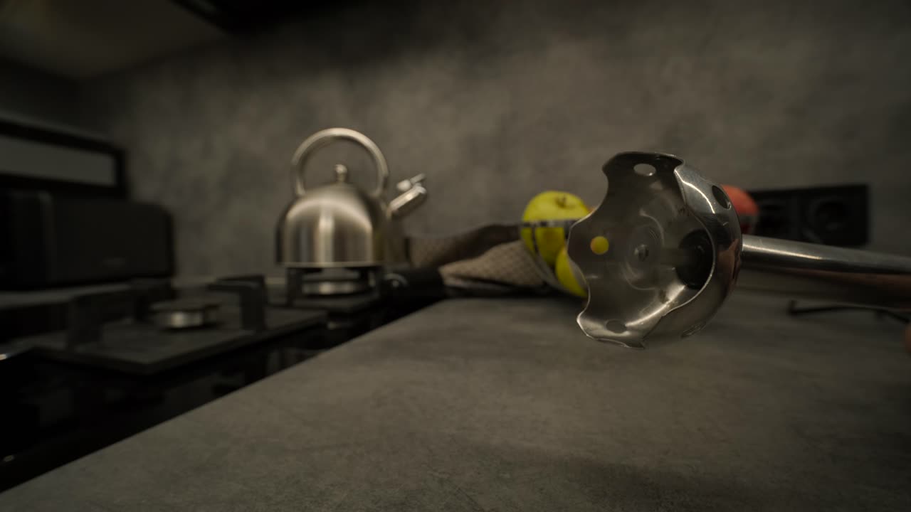 Close-Up of an Immersion Blender Operating in a Modern Kitchen