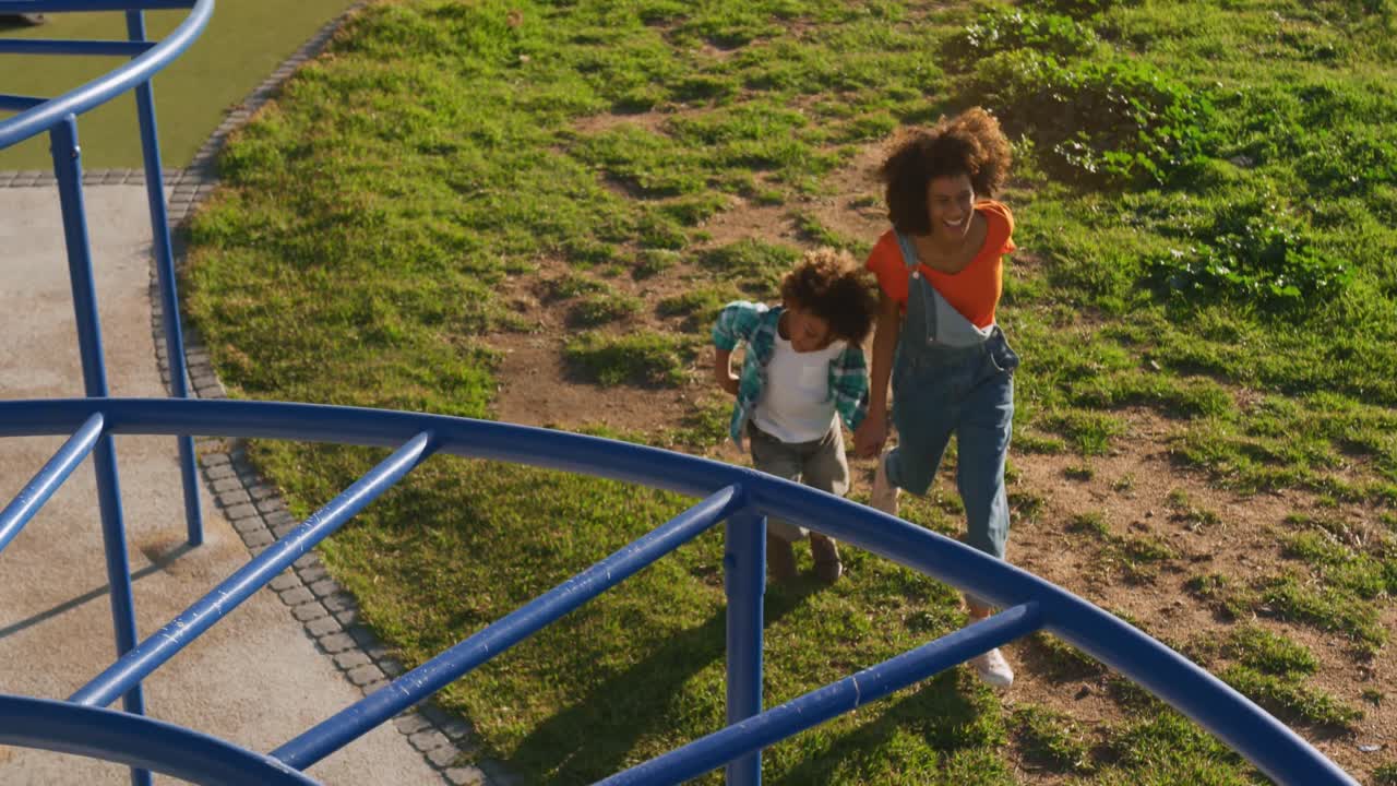 Mother and son having fun at playground