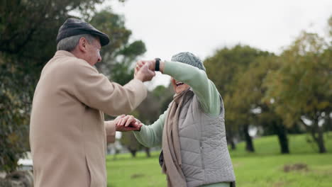 senior couple, dancing and happy outdoor at a park