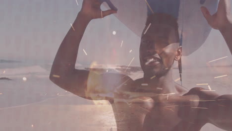 Holding surfboard, man on beach with animation of abstract light effects