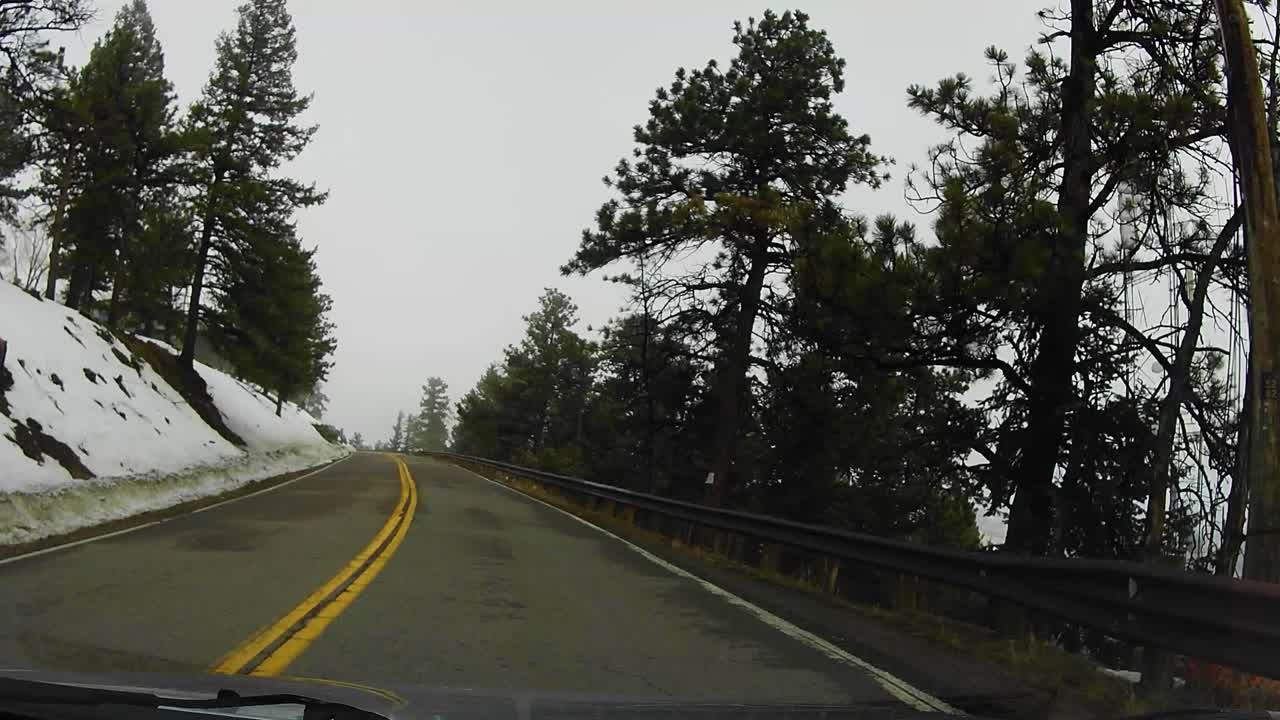 Driving through Mountainous Foggy Roads