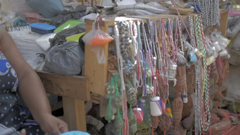 African-woman-informal-trader-makes-beaded-sangoma-headpiece,-Durban