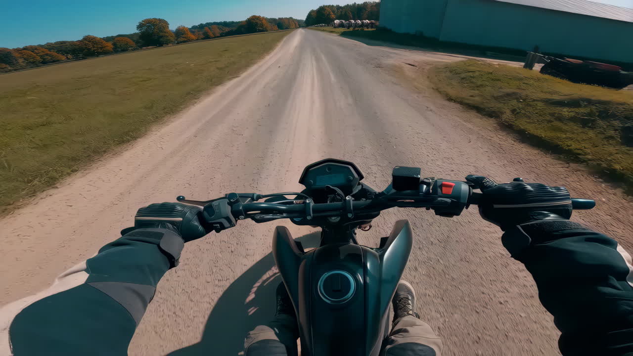 First-Person View of Riding a Motorcycle on a Dirt Road