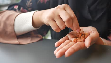 Woman eating almonds