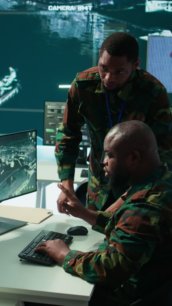 Vertical Video Military staff in a modern operations hub handling critical information