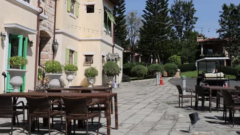 a panoramic view of a serene outdoor dining space