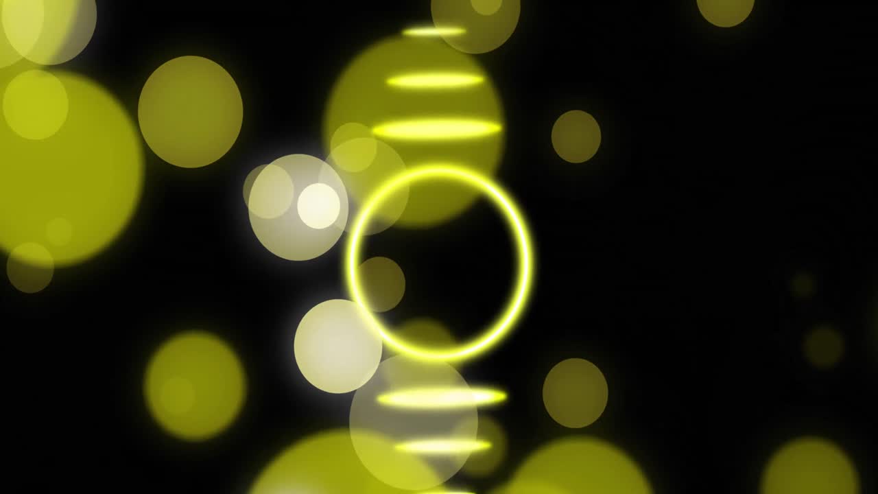 검은 바탕 위에 움직이는 노란색 반 ⁇ 이는 모양의 애니메이션