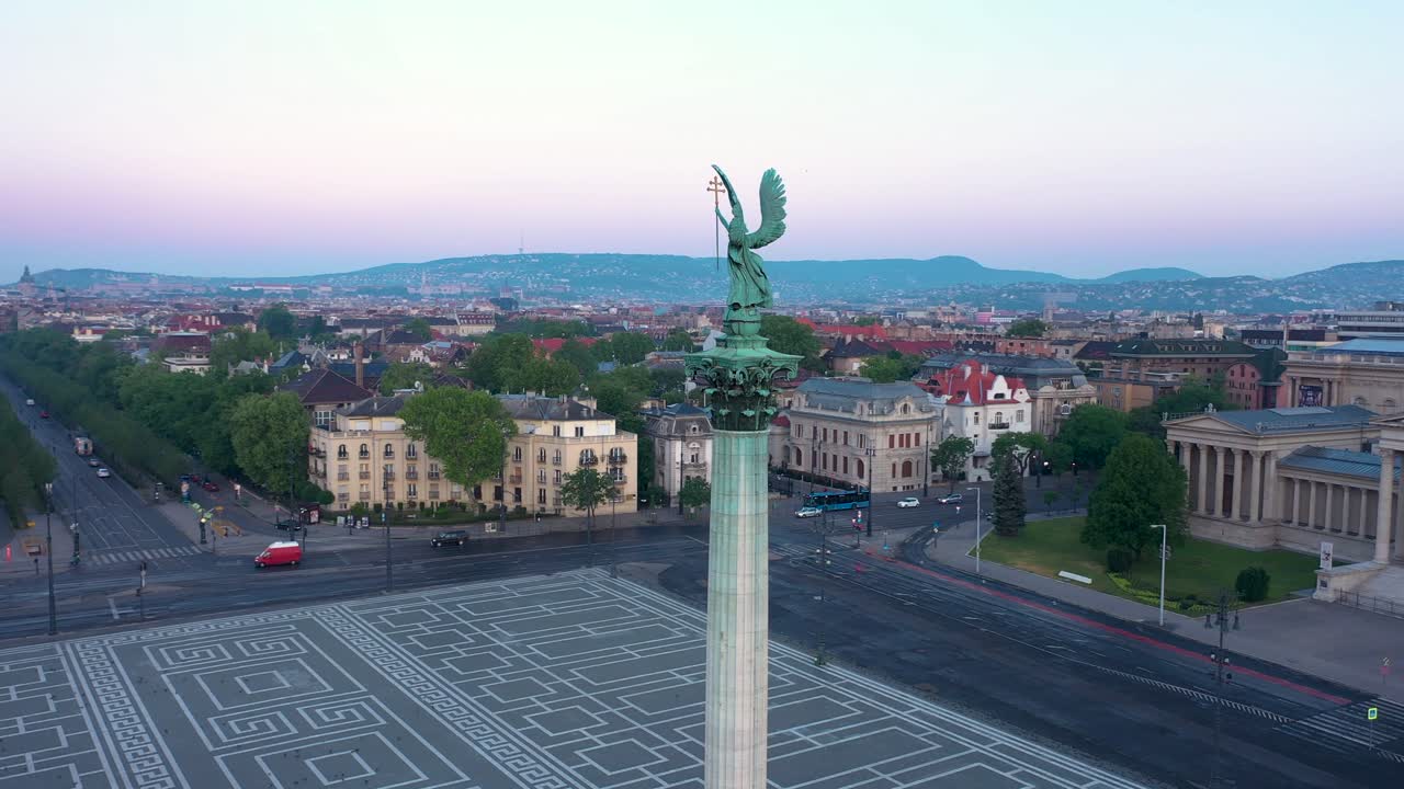 Drone footage of the empty Heroe's Square in Budapest, Hungary at the time of the Covid virus. Early morning at the sunrise in spring.
Drone circles slowly right.