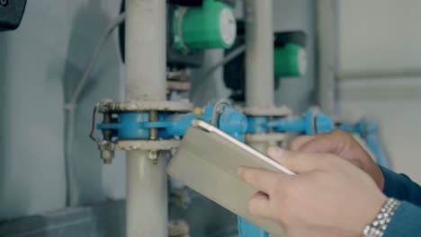 maintenance technician inspecting piping system