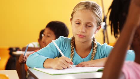 school kids studying in classroom