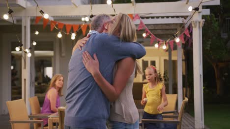 Senior-man-hugging-his-daughter-outdoors