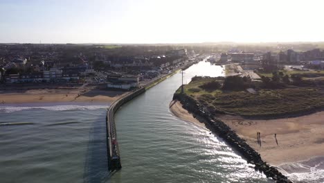 aerial-view-from-the-ocean-of-courseulles-sur-mer-with-a-beautiful-sunset